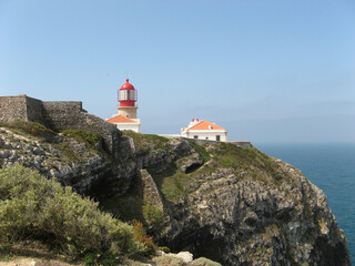 Fototapeta na wymiar Lighthouse on Cape Saint Wincenty on a sunny summer day, Algarve, Portugal