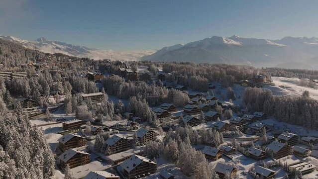 Aerial shot in Switzerland over the town of Crans Montana, Valais