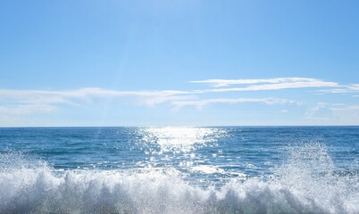 Fototapeta na wymiar Wave hitting the beach in the sea.