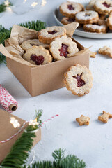 Shortcrust pastry Christmas cookies, Linzer cookies, biscuits with jam in the gift box.