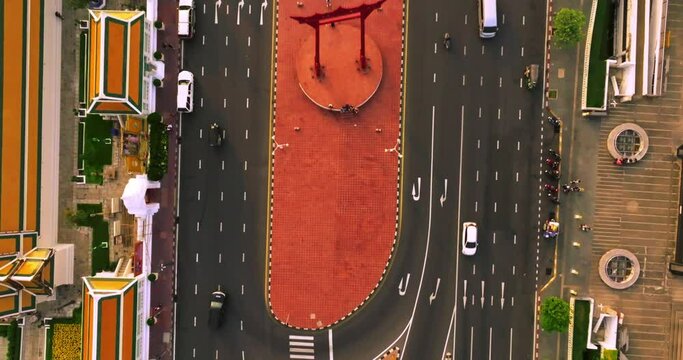 An aerial view of Red Giant Swing and Suthat Thepwararam Temple at sunset scene, The most famous tourist attraction in Bangkok, Thailand.