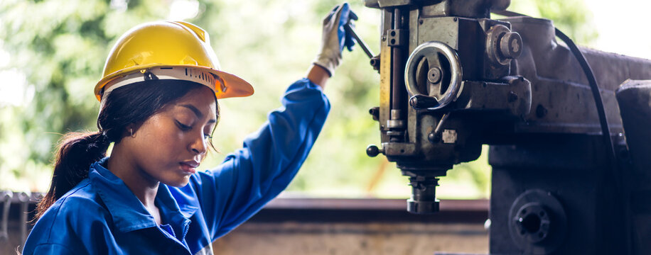 Professional Labor Machanic Engineer Technician Worker Industrial African Black Woman Wearing Blue Safety Uniform Working Control With Heavy Machine In Factory Production Line.business Industry