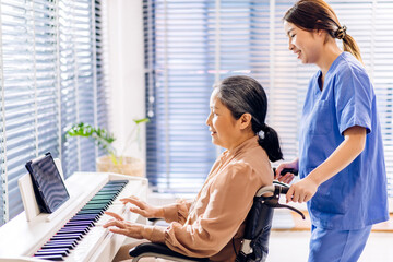 Portrait of asian nurse physiotherapist carer helping smiling and having fun teaching and play...