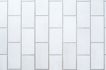 White grey tiles texture background.
