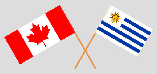 Crossed flags of Canada and Uruguay. Official colors. Correct proportion