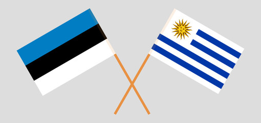 Crossed flags of Estonia and Uruguay. Official colors. Correct proportion