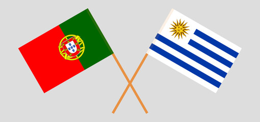 Crossed flags of Portugal and Uruguay. Official colors. Correct proportion