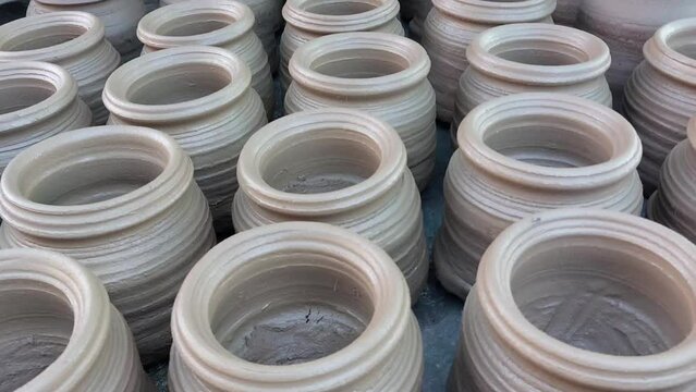 Making clay pots for storing drinking water and objects