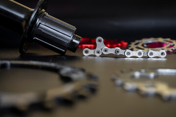 Mountain bicycle parts on dark blur background. Cycles background concept for greeting card, web design, banner and backdrop. Selected focus 