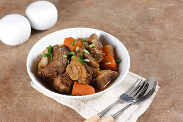 Galbijjim or KalbijJim is Korean Traditional Braised Beef Short Ribs Dish in a Rich Sauce.