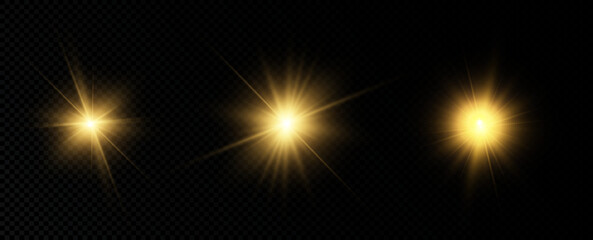 Golden particles of light. Golden light. Light flare.Stars isolated on transparent background.