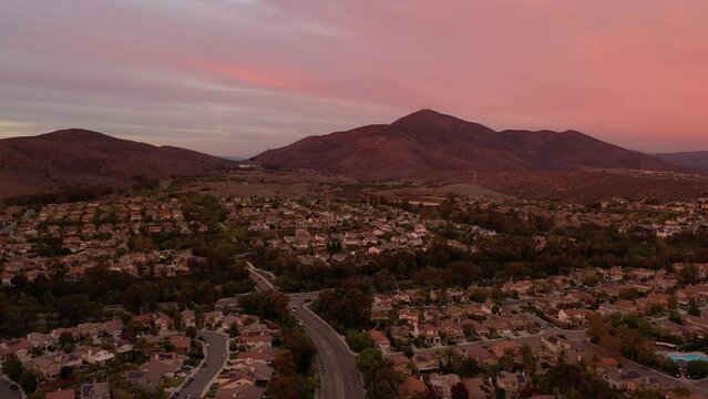 Wealthy neighborhood of Eastlake Chula Vista in San Diego California, USA. Drone flight during vibrant sunset.