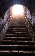 a staircase ascending to the light