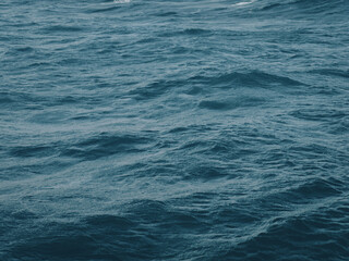 Fototapeta premium Close-up of dark waves of deep blue sea