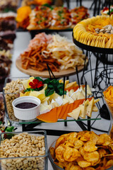 Buffet table of reception with cold snacks, meat and salads