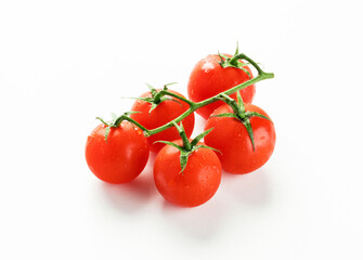 Cherry tomatoes on branch isolated on white background.
