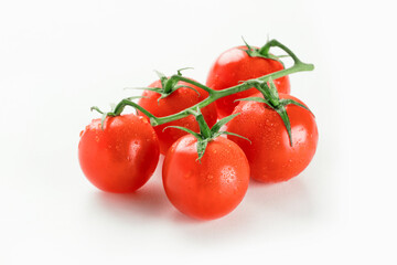 Cherry tomatoes on branch isolated on white background.
