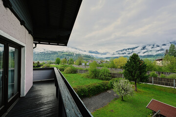 View of the yard of the house from balcony at mountain Austria.