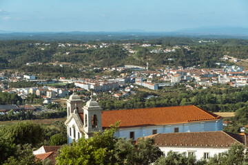 Fototapeta na wymiar Distant view across the expanse of Santarem region with the Church of Ourem in the foreground, Portugal
