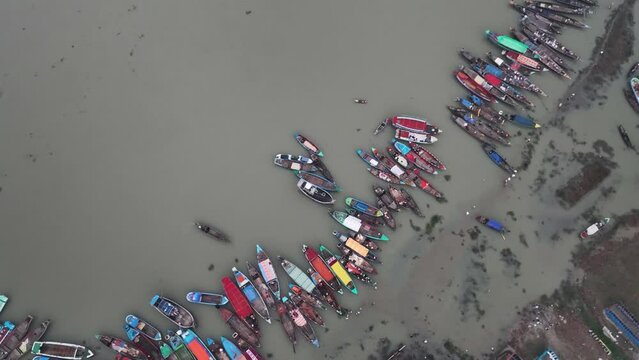 Aerial view of people along the port waiting for passengers boats at the Third largest Muslims congregation in Barisal, Bangladesh.