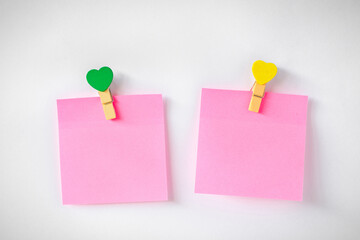 Abstract empty sticky note with heart magnet on white board. valentine greeting card message..