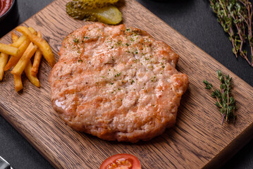 Delicious fresh grilled turkey meat steak with spices and herbs