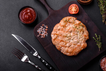 Delicious fresh grilled turkey meat steak with spices and herbs