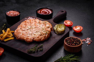 Delicious fresh grilled turkey meat steak with spices and herbs
