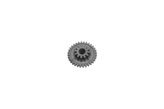 Small black plastic gear wheel isolated on white background.