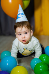 Obraz premium Babies First Birthday. One year old with colorful balloons. The boy's birthday.