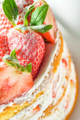 Delicious strawberry cake food with red fresh raw strawberries and white whipped cream