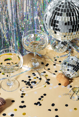 Happy new year celebration concept theme with close up on two glasses of champagne with shiny...