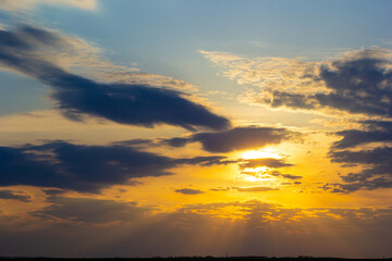 sunset sky with multicolor clouds. Dramatic twilight sky background