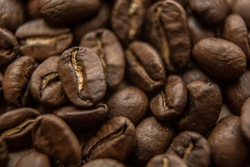 Falling Roasted Coffee Beans, Macro Shot, close-up.