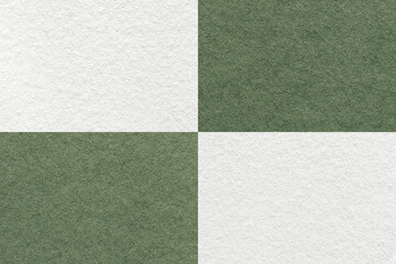 Fototapeta premium Texture of craft white and green paper background with cells pattern, macro. Structure of vintage olive cardboard.