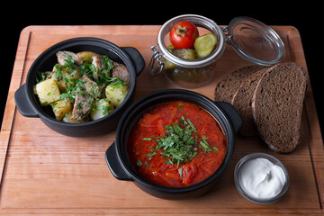 Ukrainian borscht with sour cream, potatoes with meat and pickles