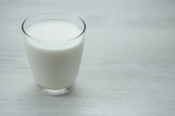 Glass of milk on wooden background ,Concept of farm dairy products with copy space.