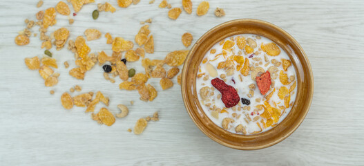 Healthy breakfast. Fresh milk with currants and berries,Cereal on wooden background.With copy space.