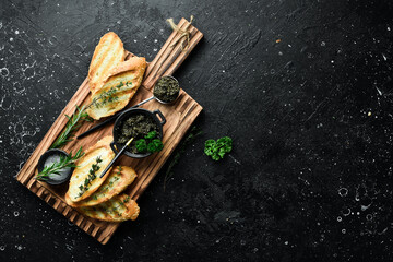 Sandwiches with caviar, on gray background, flat lay with copy space for text. Rustic style. Top view.