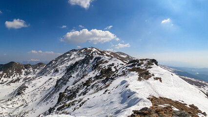 Panoramic view on the meteorological station at the snow covered summit peak of Zirbitzkogel, Seetal Alps, Styria (Steiermark), Austria, Europe. Idyllic hiking trail on sunny early spring day
