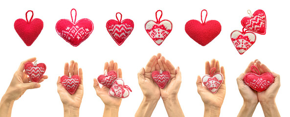 Red knitted heart in hands. Showing Heart with hands. St. Valentine's Day. Red heart gift in man...
