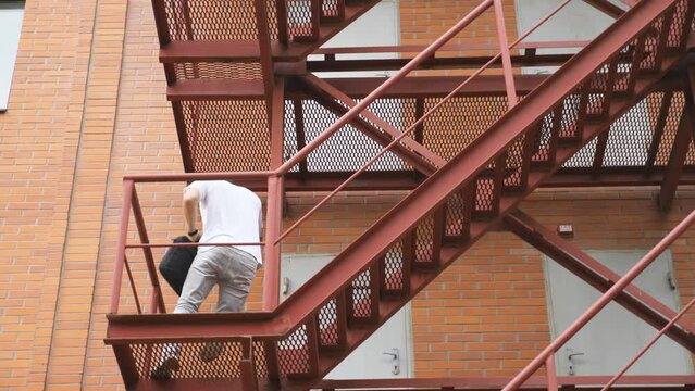 Hurry young businessman running down on stair late for work. Manager hastily climbing down staircase being going to office. Entrepreneur with briefcase going to job. Concept of morning commute