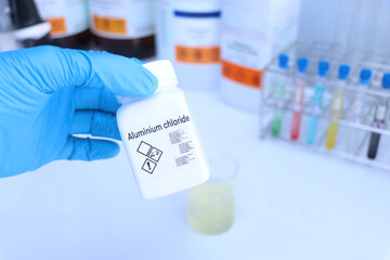 Aluminium chloride in bottle , chemical in the laboratory and industry