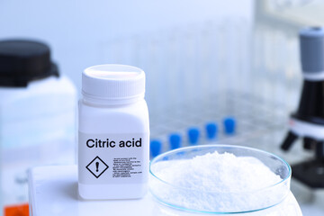 Citric acid in bottle , chemical in the laboratory and industry