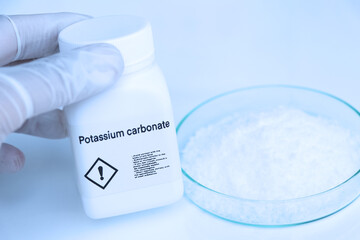 Potassium carbonate in bottle , chemical in the laboratory and industry