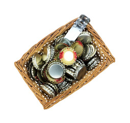 Top view of a small wicker basket full of bottle caps and opener.