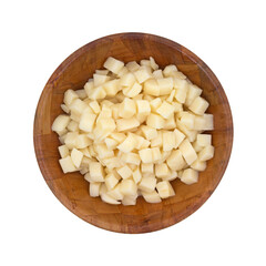 Top view of diced canned potatoes in a wood bowl isolated on a white background.