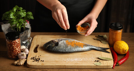 Cook sea fish with spices at home, bake dorado.