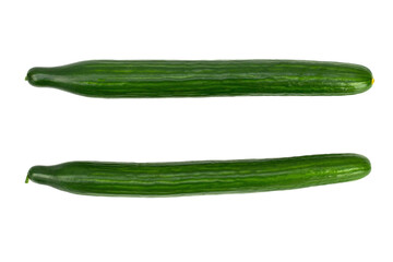 Fresh long and green cucumber on white backkground. Raw vegan food concept.