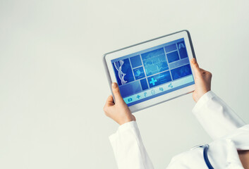 Close of female doctor hands working with tablet pc computer